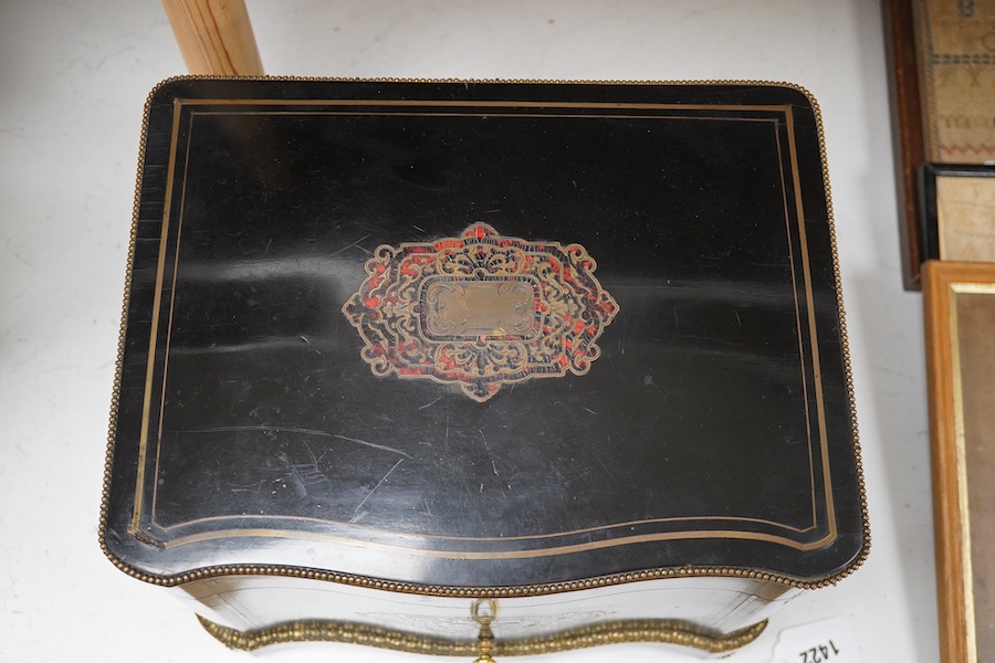 A 19th century Boulle panelled and decorative brass work liqueur cabinet, the interior fitted with gilt fitments, four cut glass decanters and sixteen liqueur glasses, 34cm wide, 26cm high. Condition - minor scratches to